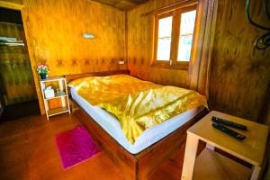 Postel nebo postele na pokoji v ubytování Taluangjit Resort&Garden