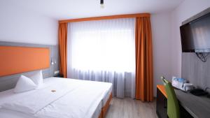Postel nebo postele na pokoji v ubytování Hotel Elite