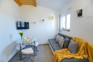 Televízia a/alebo spoločenská miestnosť v ubytovaní G&B apartment