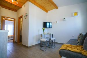 Televízia a/alebo spoločenská miestnosť v ubytovaní G&B apartment
