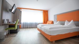 Postel nebo postele na pokoji v ubytování Hotel Elite
