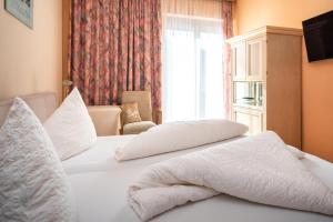 Łóżko lub łóżka w pokoju w obiekcie Erlenhof B&B