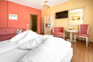 Łóżko lub łóżka w pokoju w obiekcie Erlenhof B&B