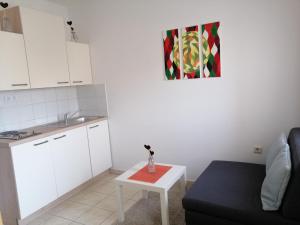 a living room with a couch and a table at Ivana in Fažana