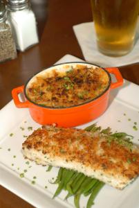 an orange pot of food on a plate with a fish at Crowne Plaza Hotel Glen Ellyn/Lombard, an IHG Hotel in Glen Ellyn