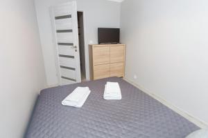 Posteľ alebo postele v izbe v ubytovaní Apartament u Jankiego