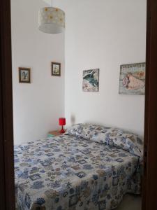 Postel nebo postele na pokoji v ubytování Borgo Bellavista Isola Rossa