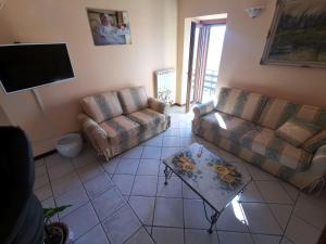a living room with a couch and a table at La Fenice in Montefiascone