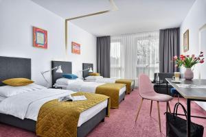 Postel nebo postele na pokoji v ubytování Hotel Arche Geologiczna