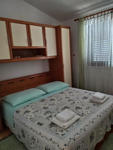 Postel nebo postele na pokoji v ubytování Apartments Pilić + 37 fotografií