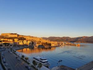 a view of a river with boats in a city at Loft Vista Mare Elba in Portoferraio