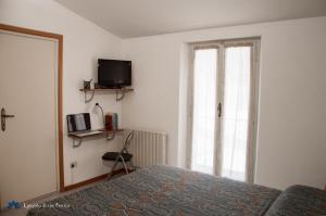 Voodi või voodid majutusasutuse Angolo di Via Fiorita toas