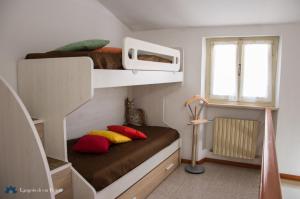 Ένα ή περισσότερα κρεβάτια σε δωμάτιο στο Angolo di Via Fiorita