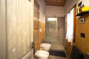 a bathroom with a toilet and a glass shower at Silvia in S.Reparata in Florence