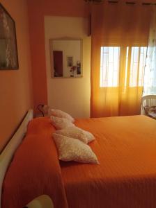 Ένα ή περισσότερα κρεβάτια σε δωμάτιο στο Villa Margherita