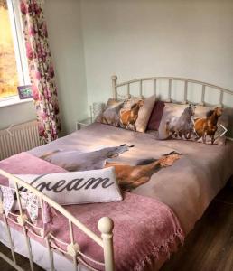 a bedroom with a bed with dogs on it at The Hen House in Carrick on Shannon