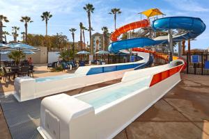 a water slide in a pool at a resort at Cambria Hotel & Suites Anaheim Resort Area in Anaheim