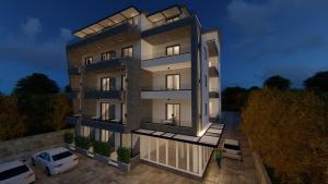 a rendering of a building with a parking lot at Apartments Cungu in Ulcinj