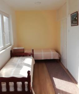 Postel nebo postele na pokoji v ubytování Dora Apartment