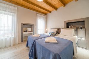 Posteľ alebo postele v izbe v ubytovaní Dimitrios Residence Old Town Rethymno