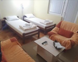 Postel nebo postele na pokoji v ubytování Dora Apartment