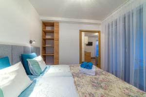 Katil atau katil-katil dalam bilik di Wicie Residence