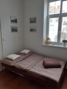 Postel nebo postele na pokoji v ubytování UBYTOVÁNÍ NA SPRÁVNÉM MÍSTĚ