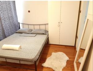 Krevet ili kreveti u jedinici u objektu 6 pax Glyfada 2floor apartment