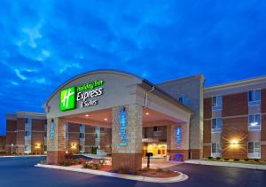 a hotel room with a sign on the front of a building at Holiday Inn Express Hotel & Suites Auburn Hills, an IHG Hotel in Auburn Hills