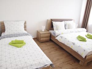 Łóżko lub łóżka w pokoju w obiekcie ADRIA exclusive apartman in the city center of Žilina