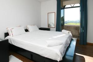 Cama ou camas em um quarto em Dias House