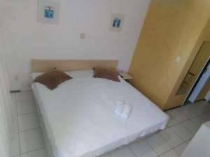Postel nebo postele na pokoji v ubytování Silva Hospedagem FLAT BELLAGIO BEIRA MAR + 10 fotografií