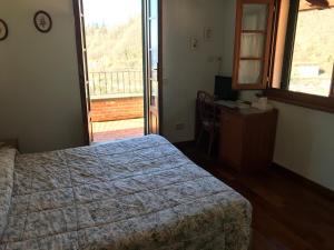 Postel nebo postele na pokoji v ubytování B&B Franceschi