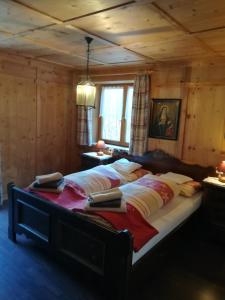 En eller flere senger på et rom på Ferienhaus/Chalet in der Blaiche