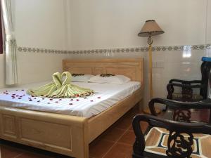 Postel nebo postele na pokoji v ubytování Tigon Flower House