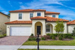 a large house with an orange tile roof at Tuscany at Westside Luxury 5 Bed, 4 Bath Villa near Disney in Kissimmee
