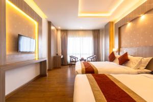 Letto o letti in una camera di Landmark Kathmandu