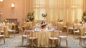 a room full of tables and chairs with tablesktop at Crowne Plaza Indianapolis-Dwtn-Union Stn, an IHG Hotel in Indianapolis