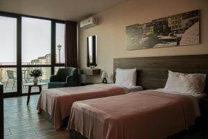 Ein Bett oder Betten in einem Zimmer der Unterkunft Hotel Grand View in Tbilisi