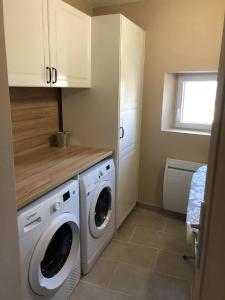 a laundry room with a washer and dryer at Provence Luberon Bonnieux location gite chez Marcelle in Bonnieux +6 photos