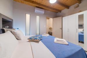 Posteľ alebo postele v izbe v ubytovaní Dimitrios Residence Old Town Rethymno