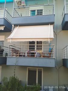 an awning on a balcony of a building at Fanari Maisonette in Fanari