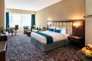 Gulta vai gultas numurā naktsmītnē Golden Tulip Doha Hotel
