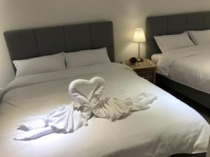 Postel nebo postele na pokoji v ubytování 單眼皮民宿 Single Eyelid Hostel