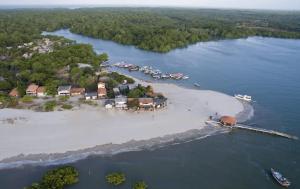 an aerial view of an island with boats in the water at HOSTEL MAIANDEUA in Algodoal