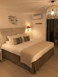 Postel nebo postele na pokoji v ubytování Finca Pura, Clothing Optional Guestrooms