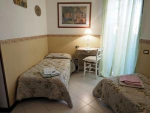 Posteľ alebo postele v izbe v ubytovaní Casa Margherita Affittacamere B&B + 12 fotografií