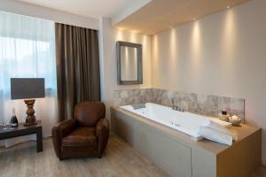 Телевизор и/или развлекательный центр в Hotel Dimorae Rooms and Suites - Apartments