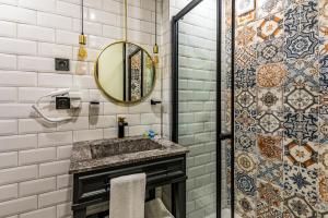 a bathroom with a sink and a mirror at Interstar Hotel in Istanbul