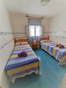 Cama o camas de una habitación en Apartamentos herederos Lm